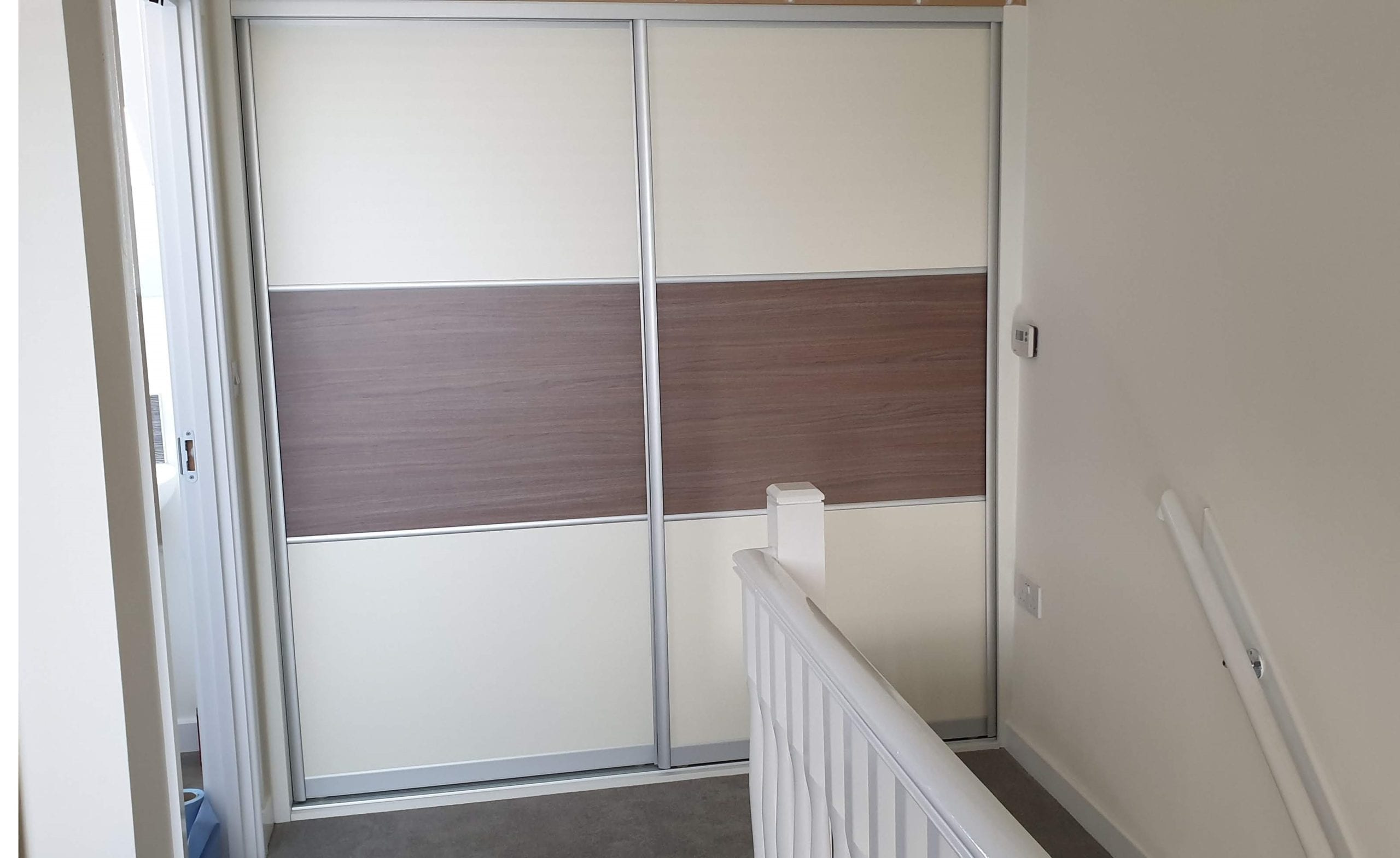 White and brown sliding doors wardrobe