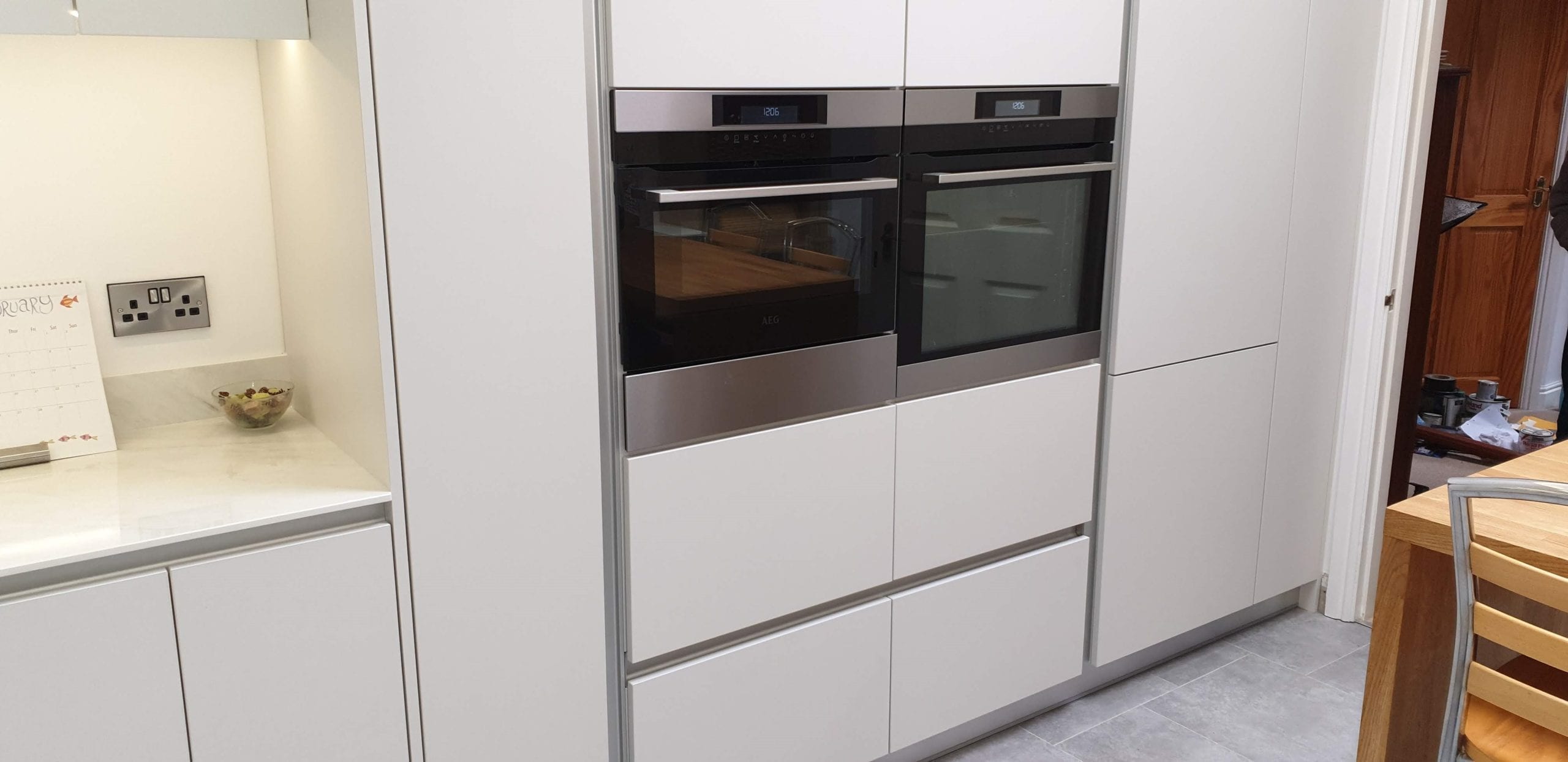White, and aluminium handleless kitchen furniture Ilkley 